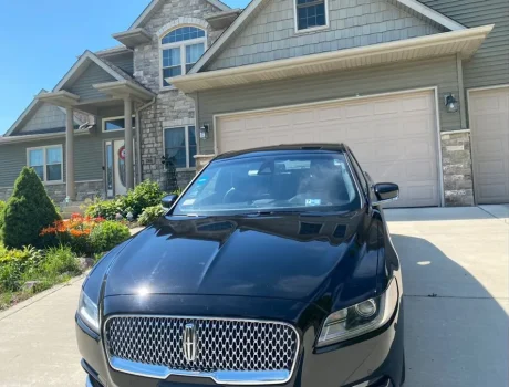 Lincoln Continental in front of house